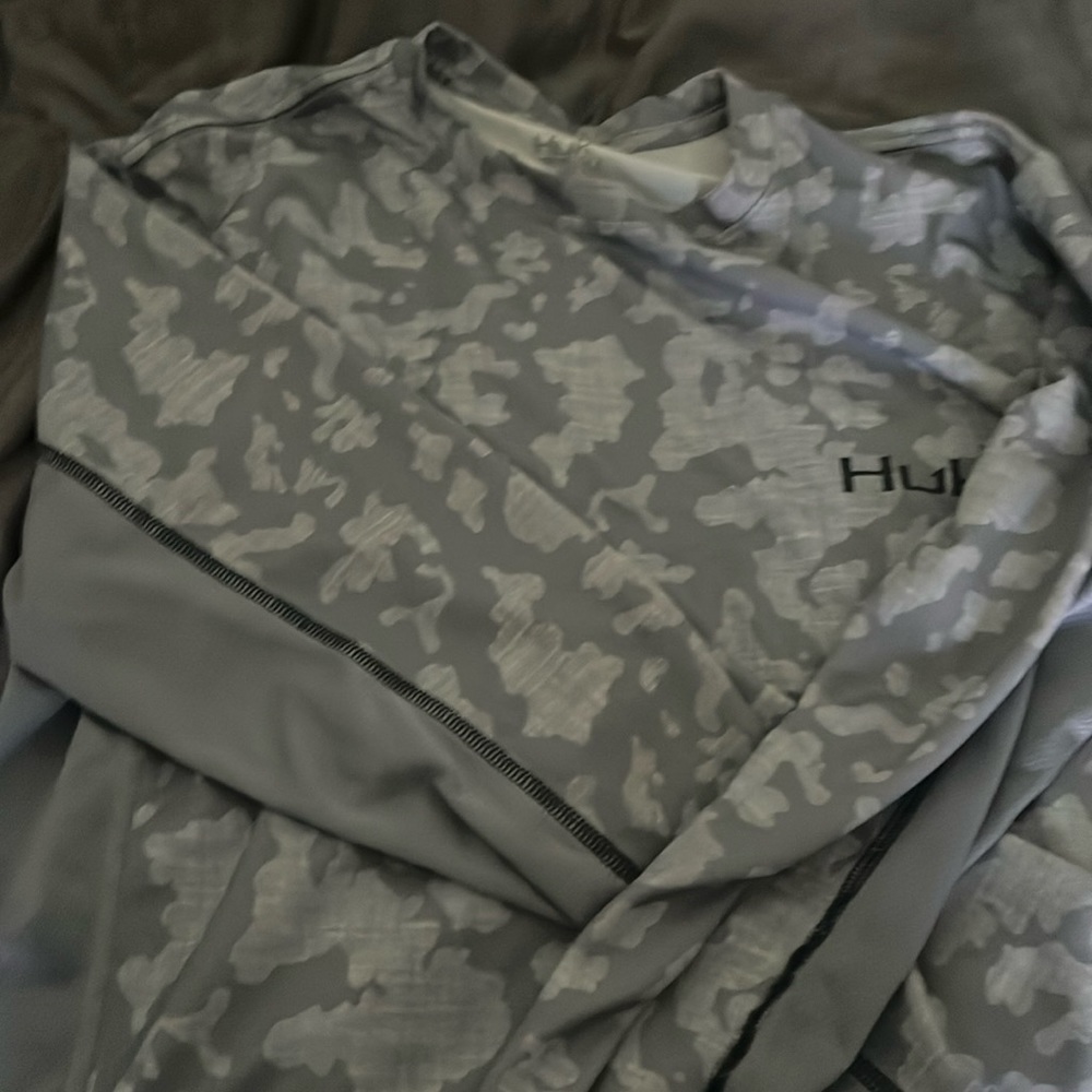 A HUK swim shirt